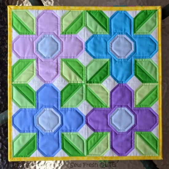 easy-flower-block-makes-a-stunning-mini-quilt-quilting-digest