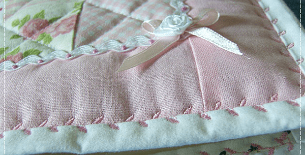 Quilt with Binding Secured with a Deorative Stitch