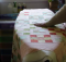 Easily Baste a Quilt on Your Ironing Board