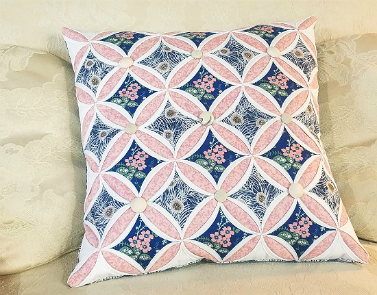 Cathedral window patchwork store cushion