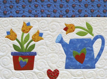 https://www.awin1.com/cread.php?awinmid=6220&awinaffid=257599&clickref=Tulip-And-Watering-Can-Quilt&ued=https%3A%2F%2Fwww.etsy.com%2Flisting%2F198526751%2Ftulip-and-watering-can-quilt-pattern