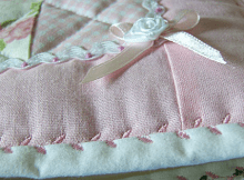 Quilt with Binding Secured with a Deorative Stitch